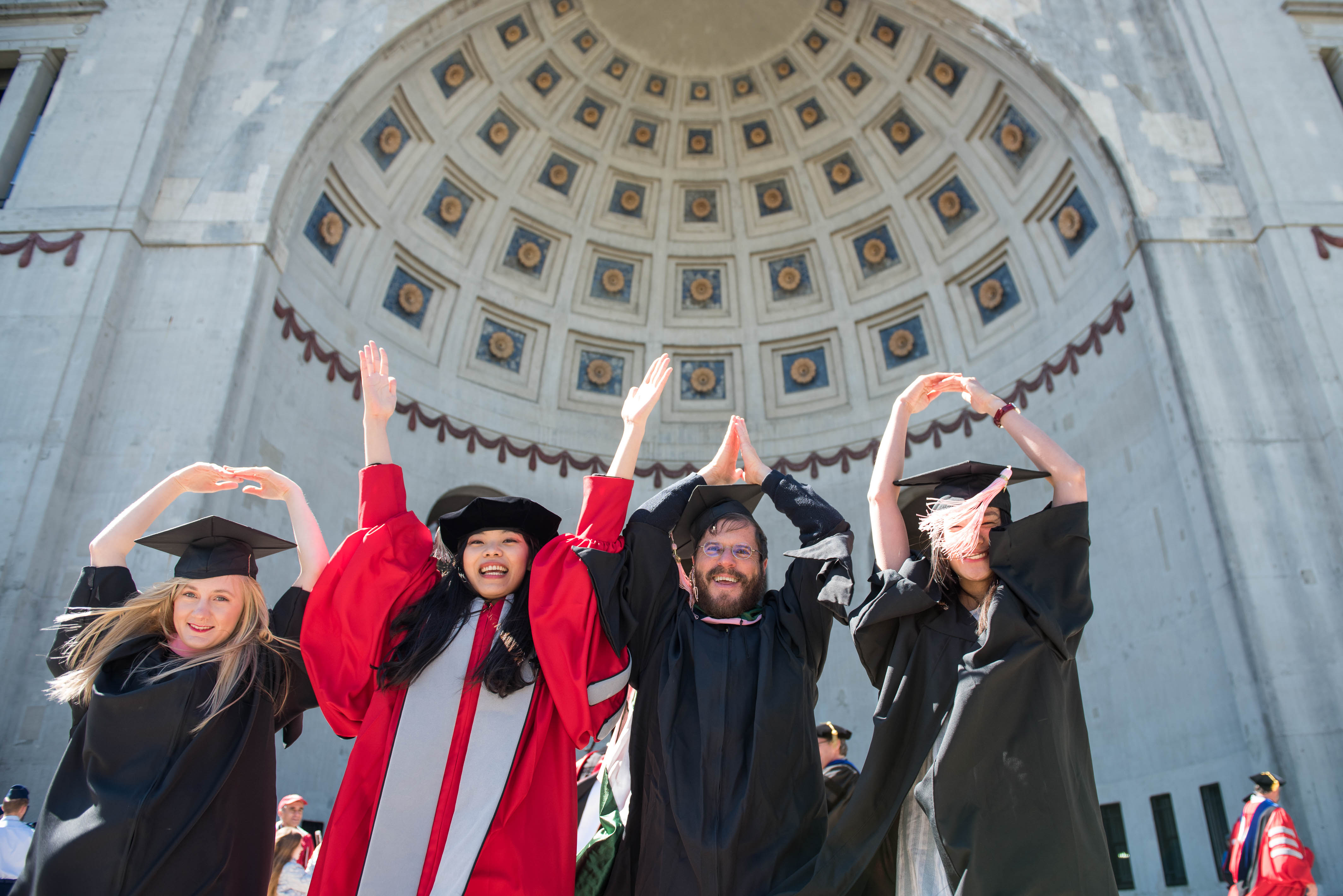 students posing for OHIO in during commencement