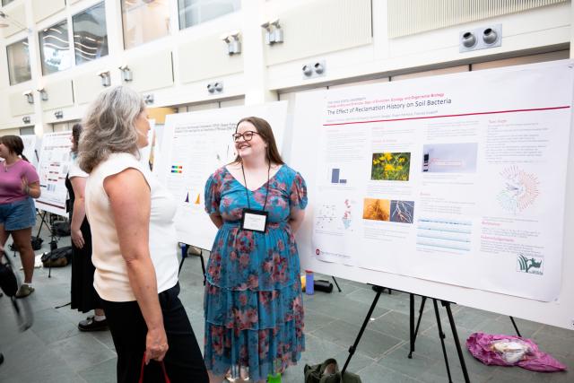 Mary Stromberger, dean of the graduate school (left) learning about Madalyn Hartley’s (right) SROP research. 