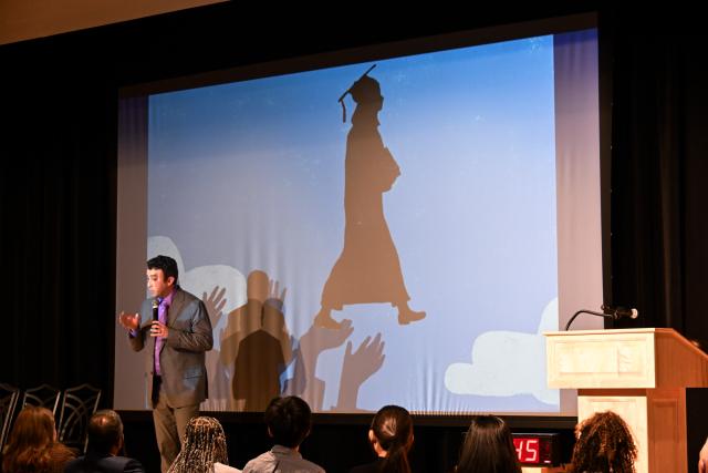 Andrew Perry presenting on stage