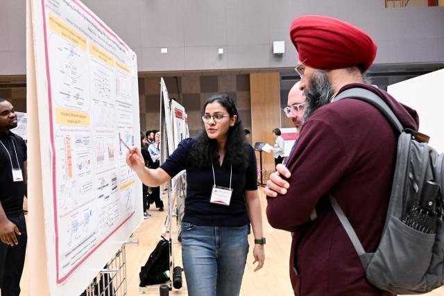 MCDB graduate student Debadrita Paul presenting her poster to Guramrit Singh, Associate Professor, Molecular Genetics