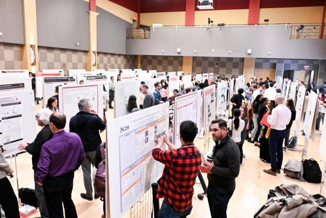 Poster presentation session in the Ohio Union’s ballroom, where students present their research to faculty judges and attendees