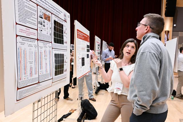 Neuroscience graduate student Rebecca Boland presenting to Cole Harrington, Assistant Professor, Neurology