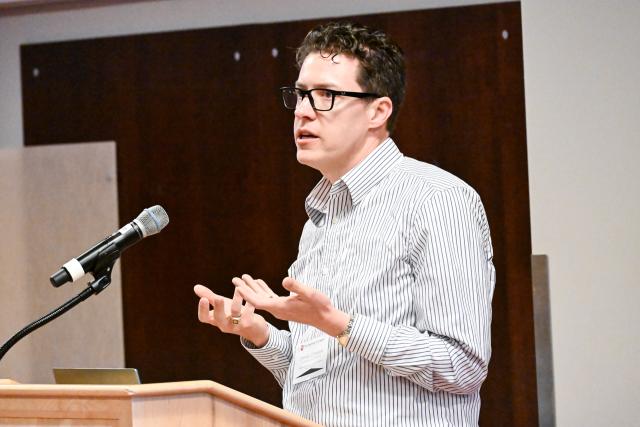 Daniel Conway, Professor, Biomedical Engineering presenting behind a podium