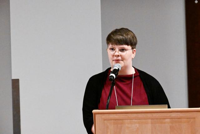 Neuroscience Graduate Program student Meretta Hanson presenting behind a podium
