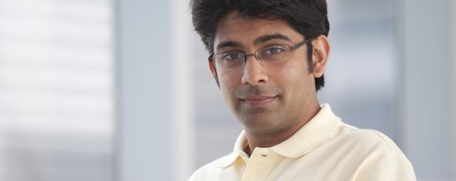 Male in yellow shirt and glasses portrait