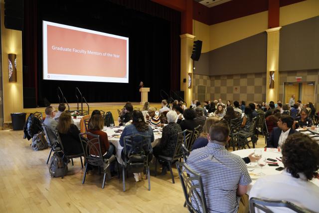 2023 Award Ceremony attendies watchign a the presentation in the Ohio Union Performance Hall