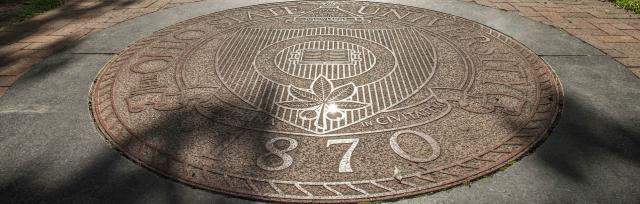 Photograph of the Ohio State seal on the Oval on Ohio State campus.