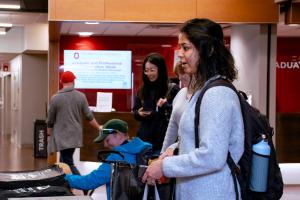 Graduate students picking up giveaways from the graduate school and council of graduate students in University Hall as part of appreciation week.