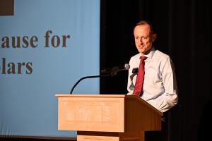 Matt Page, senior assistant dean for graduate student experiences speaking behind a podium
