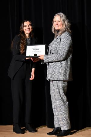Mary Stromberger presenting Charis Stanek with a 2nd place certificate.