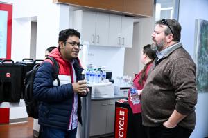 Dean and student enjoying coffee and having a discussion