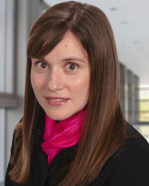 Jill C. Heathcock in a black blazer and pink scarf