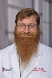 portrait of Dr. James Cray in a white lab coat