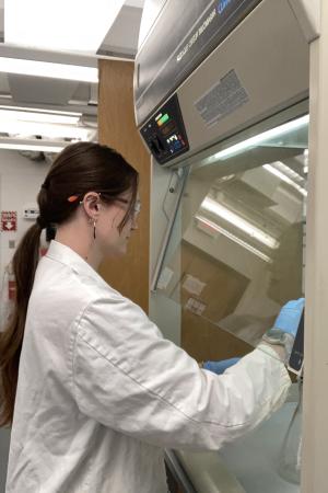 Jamison performing research in an environmental control lab