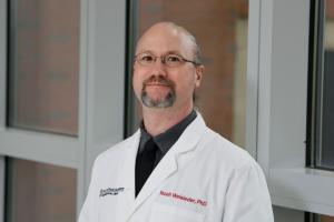 portrait of Noah Weisleder in a an OSU lab coat