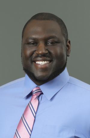 Portrait of Pelumi Kareem in a blue short and tie