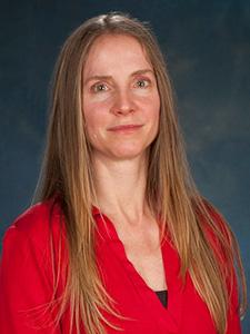 Leslie More portrait in a red shirt