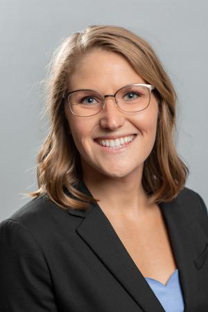 portrait of Tracy Roach with Blonde Hair in a Black suit jacket