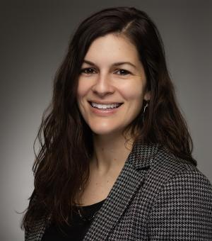 Alyssa Bedrosian in a black shirt and checkered blazer